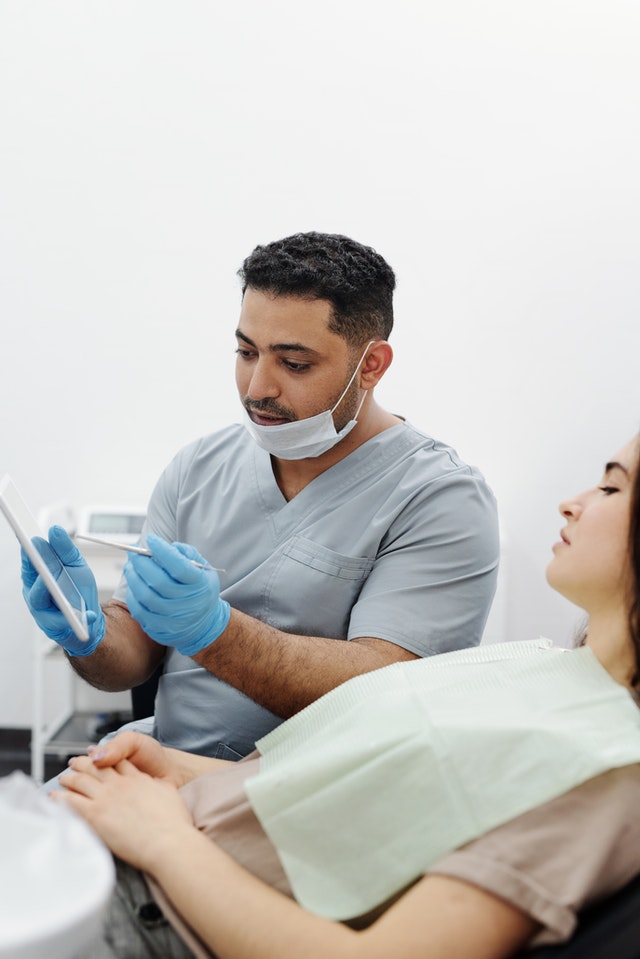 dentist reviewing procedure with patient