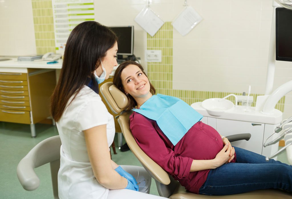 Woman talking to her dentist about what to do about cavities under a dental crown 